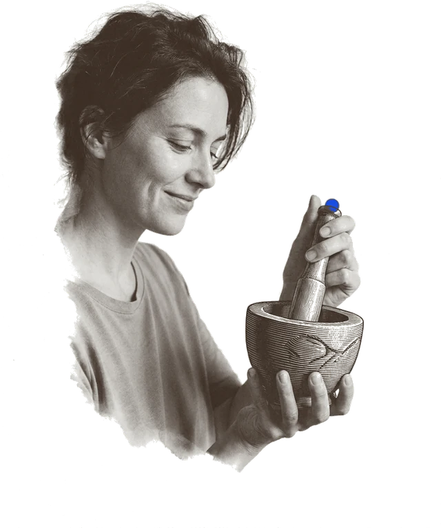 Someone holding a small sealed sample vial up to the light